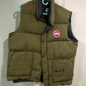 A Canadian goose down vest size large.